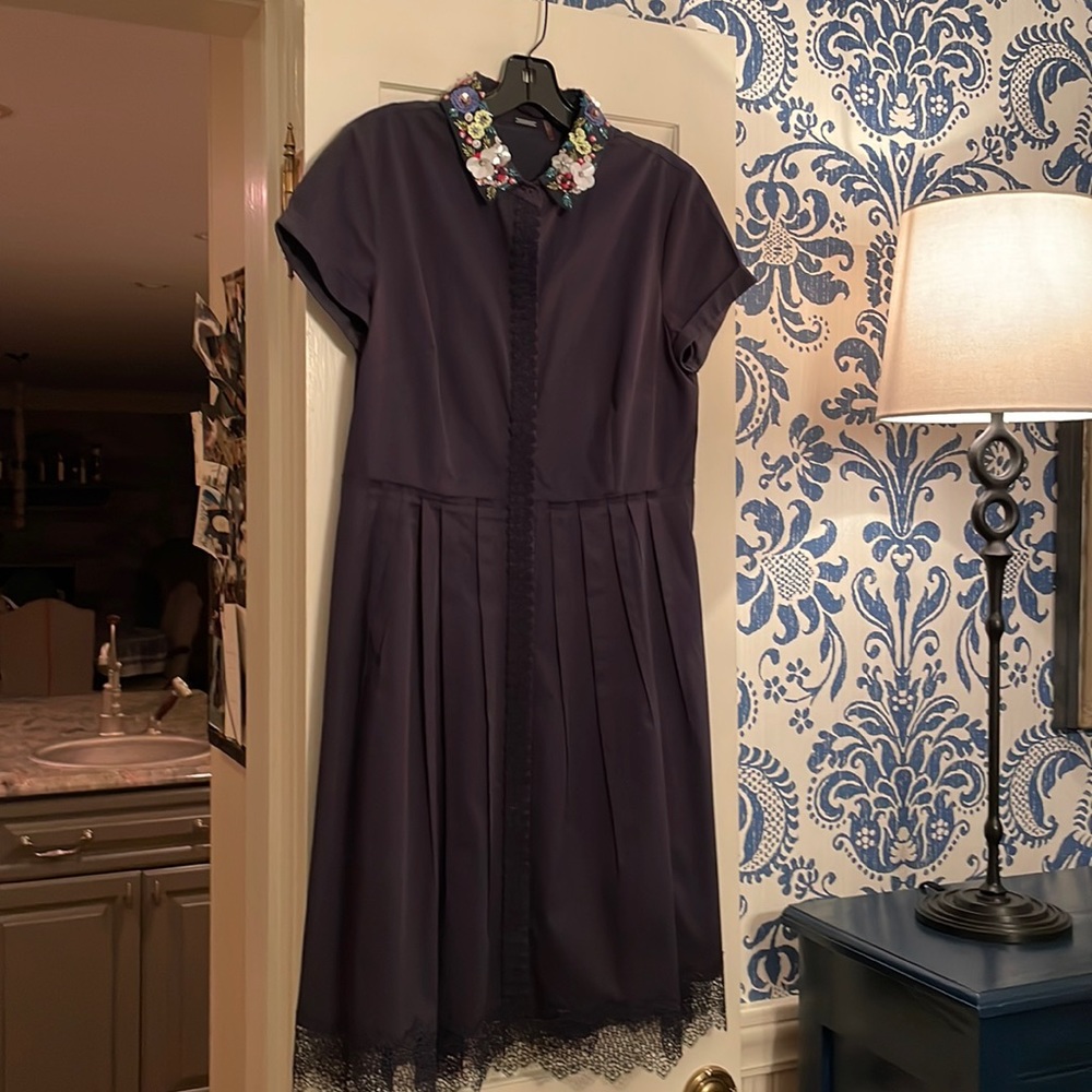 Adorable dress, navy blue, buttons up the front.